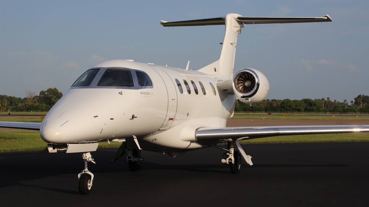 Embraer Phenom 300 N329MC parked on the ramp